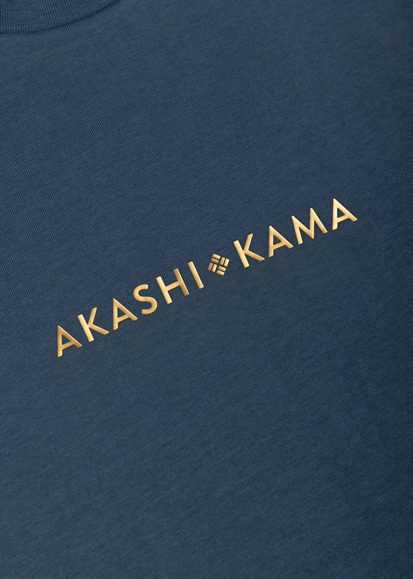 Metallic gold 3D silicon stamped logo on AKASHI-KAMA Koi Blue tee