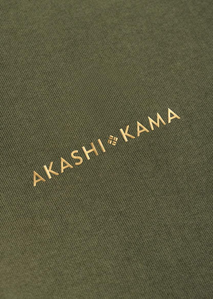 Metallic gold 3D silicon stamped logo on AKASHI-KAMA Olive tee