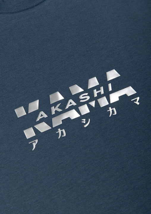 Metallic silver 3D silicon track logo on AKASHI-KAMA Koi Blue tee