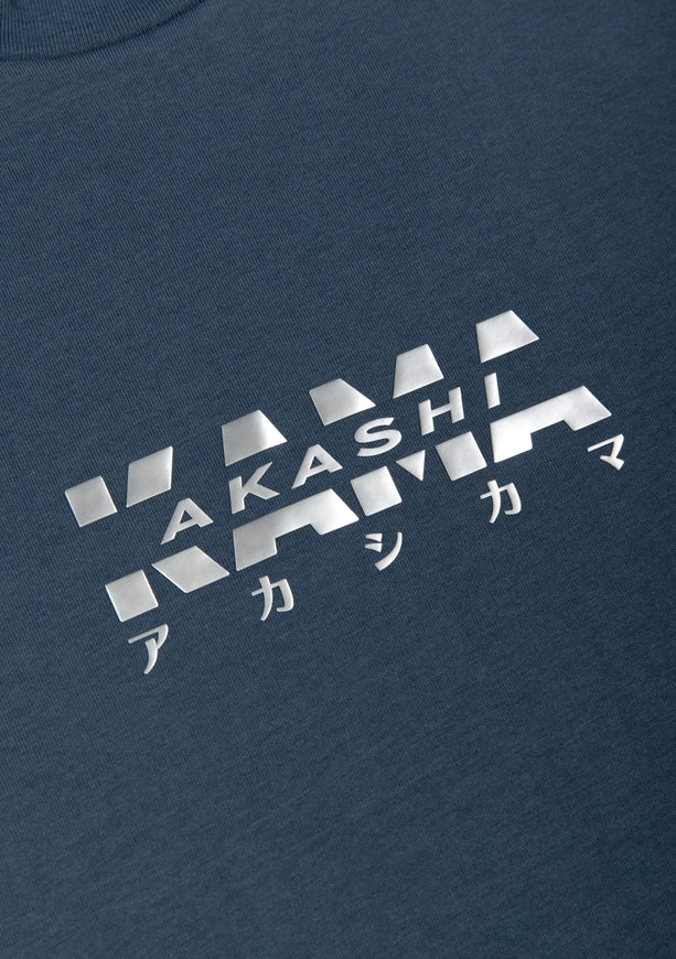 Metallic silver 3D silicon track logo on AKASHI-KAMA Koi Blue tee