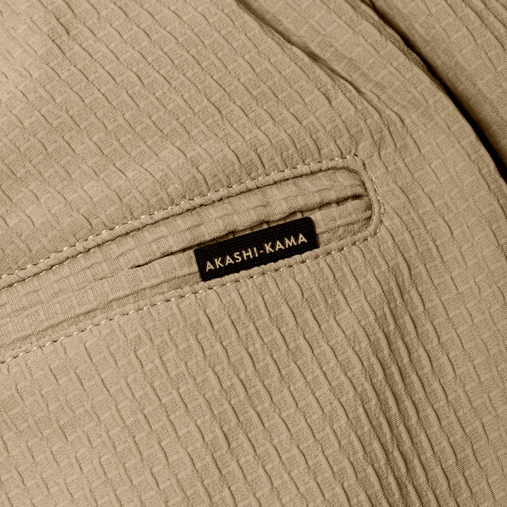 Technical Sashi Clay textured fabric with back pocket and AKASHI-KAMA label