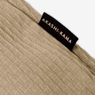 AKASHI-KAMA side label on beige textured Technical Sashi Clay tailored shorts