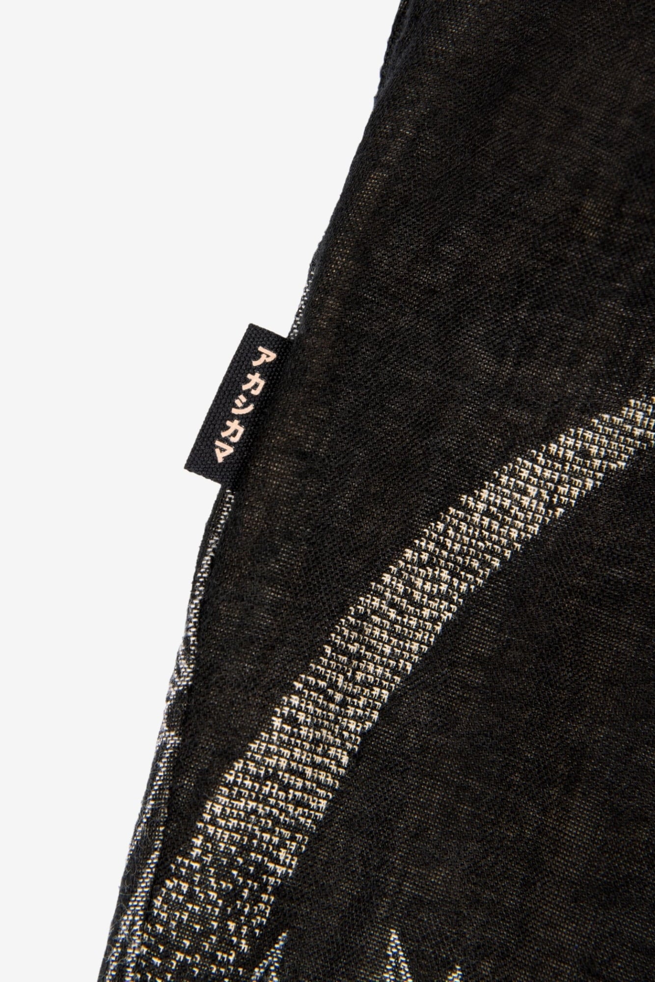 AKASHI KAMA Flag tag detail Pleated Trousers Pants