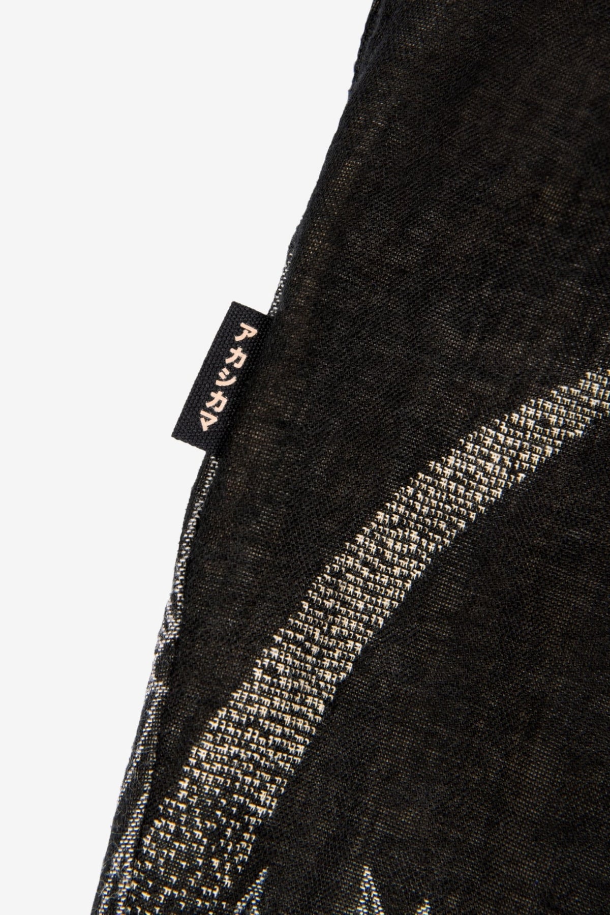 AKASHI KAMA Flag tag detail Pleated Trousers Pants