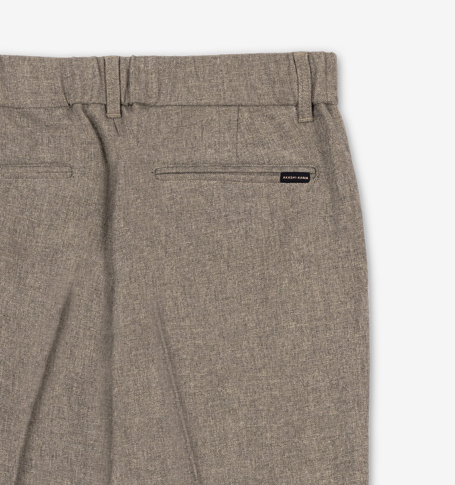 Mocha Taupe pleated trousers pocket and 
AKASHI-KAMA label back detail