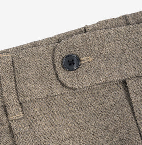 AKASHI-KAMA Mocha Taupe pleated trousers showing black button closure and textured waistband