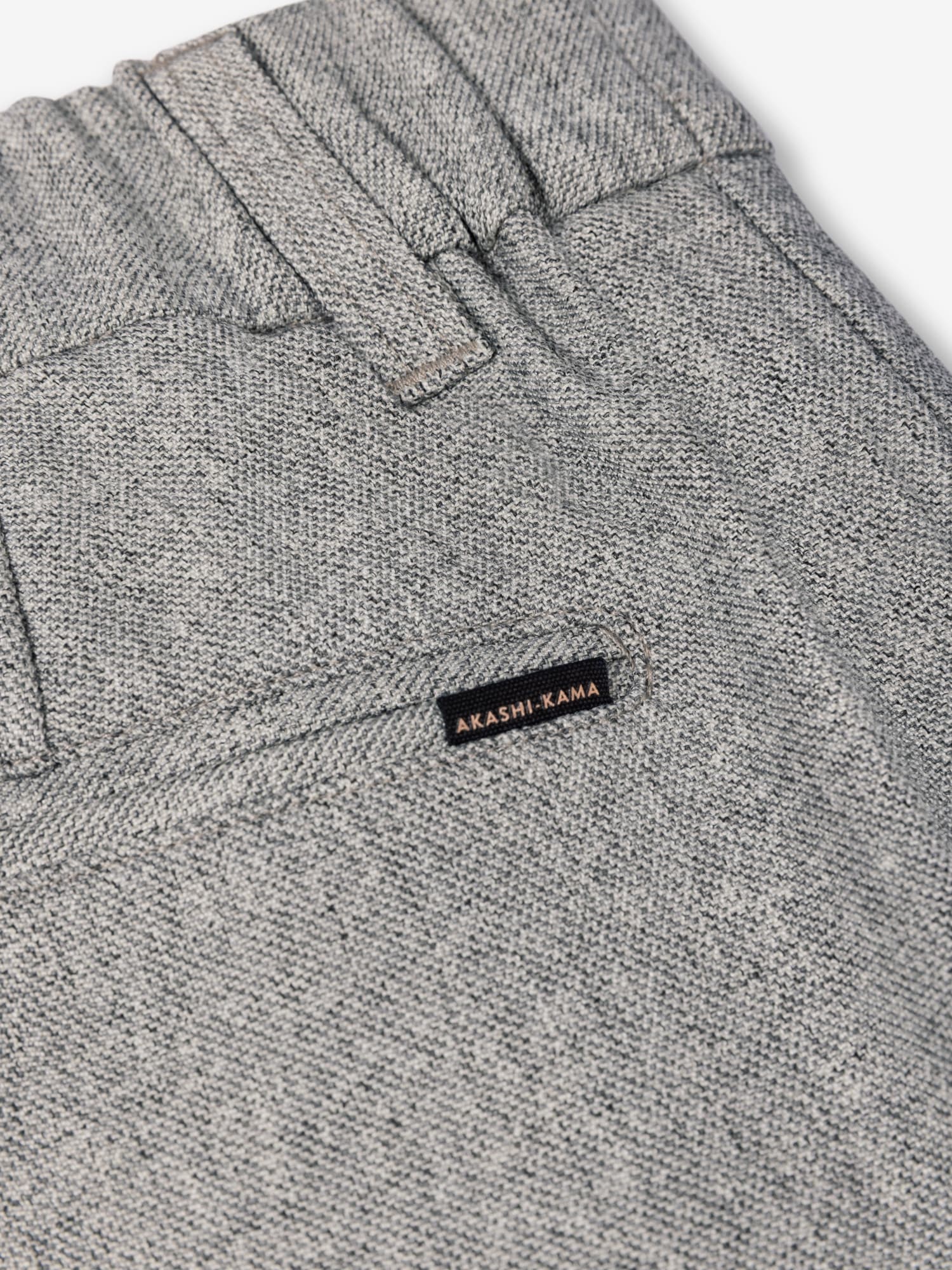 Smoke pleated trousers pocket and 
AKASHI-KAMA label back detail