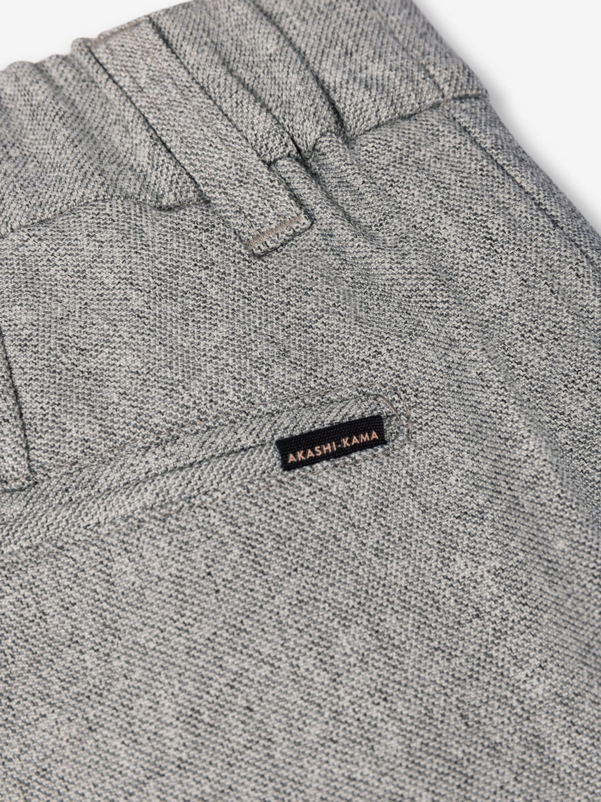 Smoke pleated trousers pocket and 
AKASHI-KAMA label back detail