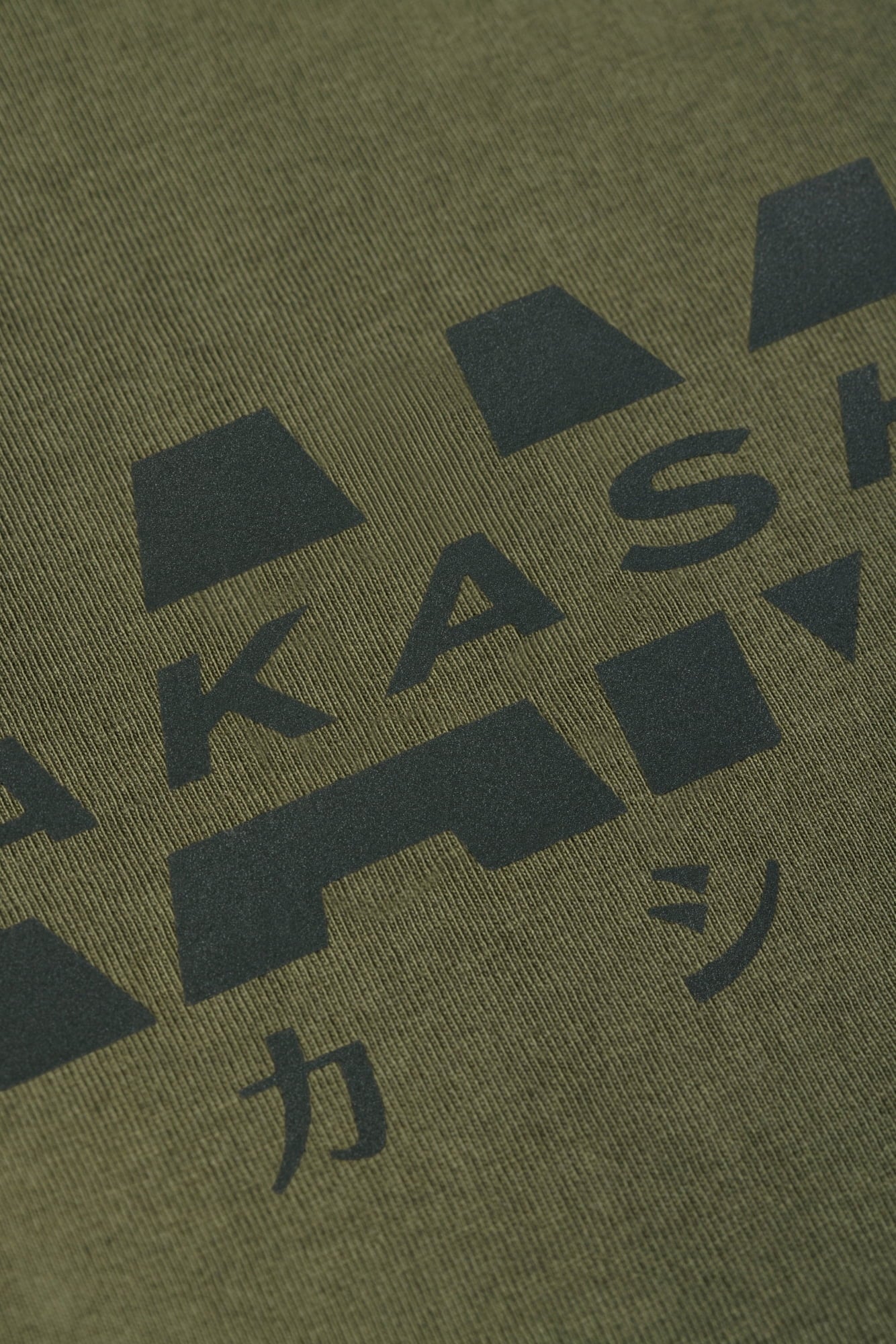 3D silicon reflective track logo on AKASHI-KAMA Olive tee
